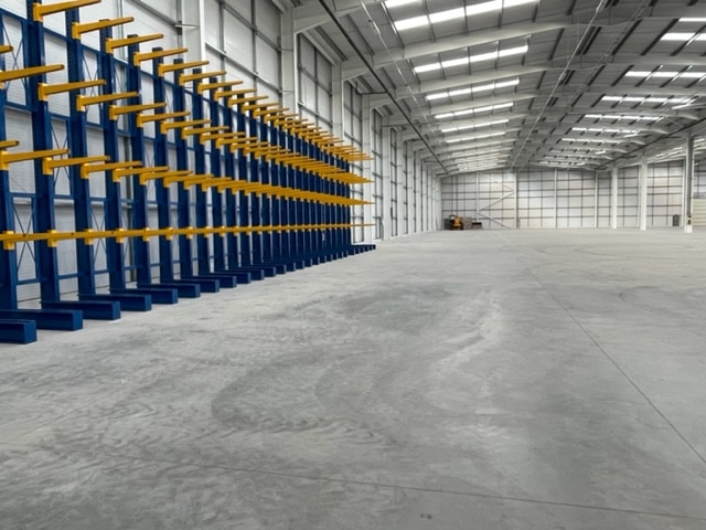 S.E.M.CO Single Sided Cantilever Racking being installed in a customer's warehouse space.
